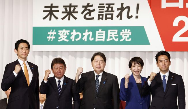 From left, Japan's former Economic Security Minister Takayuki Kobayashi, former Foreign Minister Toshimitsu Motegi, chief Cabinet Secretary Yoshimasa Hayashi, former Economic Security Minister Sanae Takaichi and Agriculture Minister Shinjiro Koizumi pose after they delivered speeches at the kick-off of the campaign for the Liberal Democratic Party's presidential election in Tokyo, Monday, Sept. 22, 2025. (Franck Robichon/Pool Photo via AP)