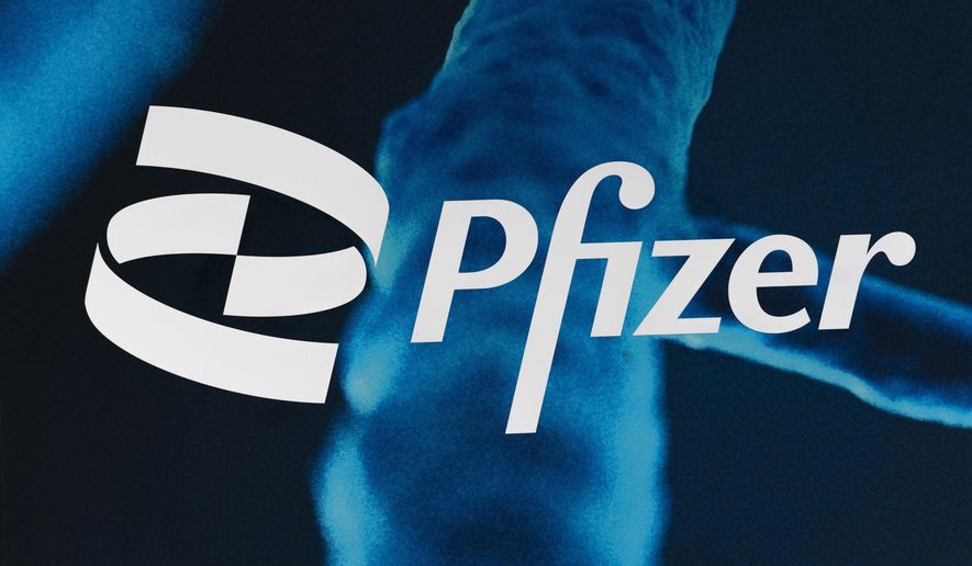 FILE - The Pfizer logo is displayed at the company's headquarters, Friday, Feb. 5, 2021, in New York. (AP Photo/Mark Lennihan, File)
