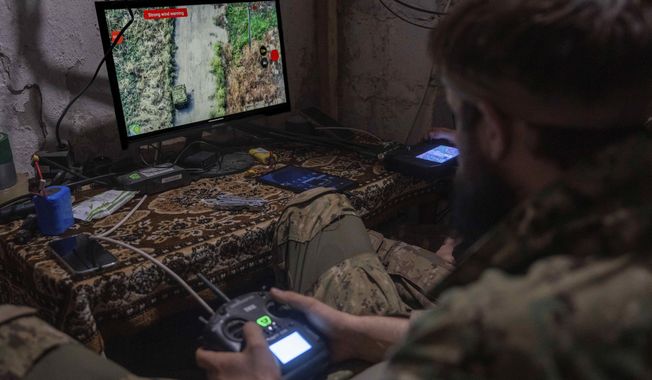 Ukrainian servicemen navigate land and aerial drones near Kostiantynivka, Ukraine, on Wednesday, Sept. 10, 2025. (AP Photo/Alex Babenko)