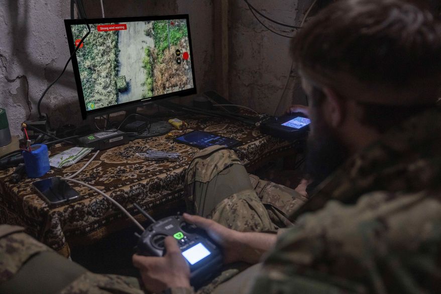 Ukrainian servicemen navigate land and aerial drones near Kostiantynivka, Ukraine, on Wednesday, Sept. 10, 2025. (AP Photo/Alex Babenko)