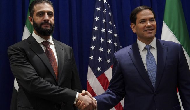 Secretary of State Marco Rubio shakes hands with Syrian interim President Ahmad al-Sharaa at the Lotte New York Palace Hotel, on the sidelines of the 80th United Nations General Assembly at the United Nations headquarters, Monday, Sept. 22, 2025. (Bing Guan/Pool Photo via AP)