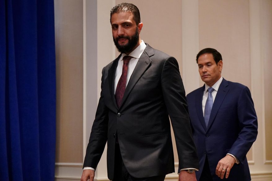 Secretary of State Marco Rubio, right, and Syrian interim President Ahmad al-Sharaa arrive ahead of a meeting at the Lotte New York Palace Hotel, on the sidelines of the 80th United Nations General Assembly at the United Nations headquarters, Monday, Sept. 22, 2025. (Bing Guan/Pool Photo via AP)