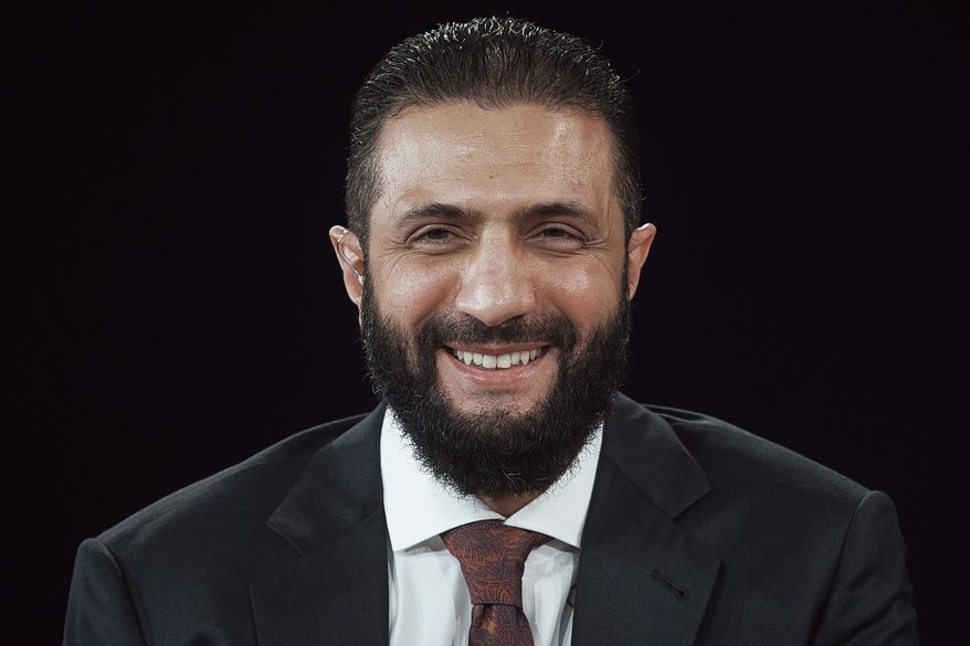 Interim Syria President Ahmed al-Sharaa smiles during the Concordia Annual Summit in New York, Monday, Sept. 22, 2025. (AP Photo/Andres Kudacki)