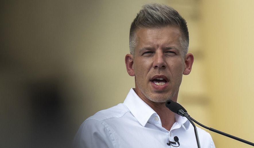 FILE -Péter Magyar, a rising challenger to Hungarian Prime Minister Viktor Orbán, addresses people at a campaign rally in the rural city of Debrecen, Hungary, on May 5, 2024. (AP Photo/Denes Erdos, File)