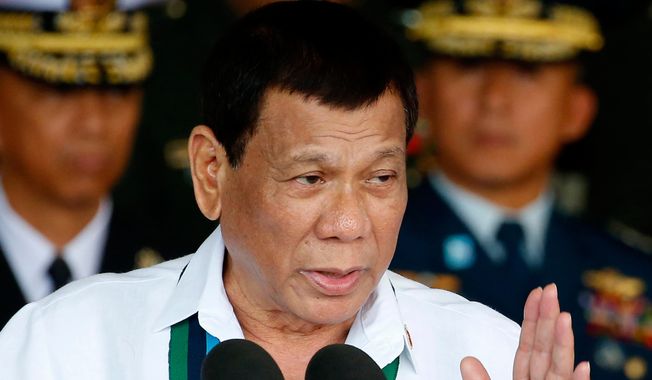 Philippine President Rodrigo Duterte addresses the troops during the 82nd anniversary celebration of the Armed Forces of the Philippines in suburban Quezon City northeast of Manila, Philippines on Dec. 20, 2017. (AP Photo/Bullit Marquez, File)