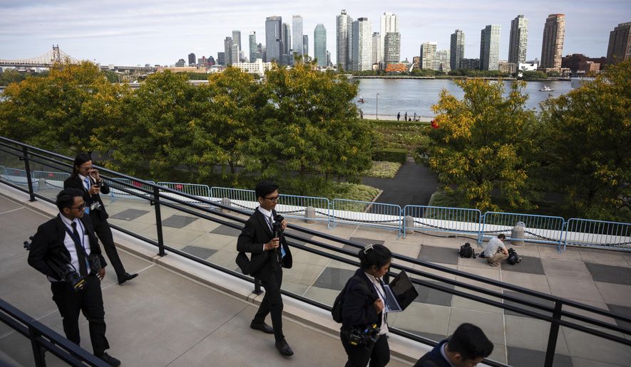 People exit the United Nations Headquarters on the first day of the 80th session of the UN General Assembly's High-Level week, Monday, Sept. 22, 2025. (AP Photo/Angelina Katsanis)