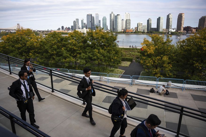 People exit the United Nations Headquarters on the first day of the 80th session of the UN General Assembly's High-Level week, Monday, Sept. 22, 2025. (AP Photo/Angelina Katsanis)