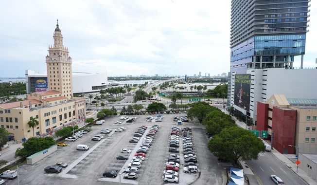 Republican Florida Gov. Ron DeSantis is proposing that President Donald Trump's presidential library be built in a parking lot that is currently used by Miami-Dade College staff and faculty and is adjacent to the Freedom Tower, Tuesday, Sept. 23, 2025, in Miami. (AP Photo/Marta Lavandier)