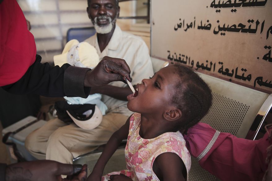 FILE - A Sudanese girl receives an oral cholera vaccine during a 10-day vaccination campaign conducted by health ministry workers in Khartoum, Sudan, Wednesday, Aug. 13, 2025. (AP Photo/Marwan Ali, File)