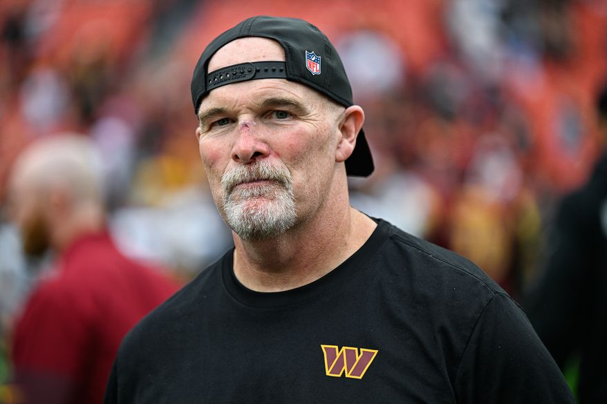 Washington Commanders head coach Dan Quinn was left bloodied and bruised after a second-quarter collision with quarterback Marcus Mariota (8) against the Las Vegas Raiders at Northwest Stadium in Landover, Maryland, September 21, 2025. (Photo by Brian Murphy for the Washington Times)