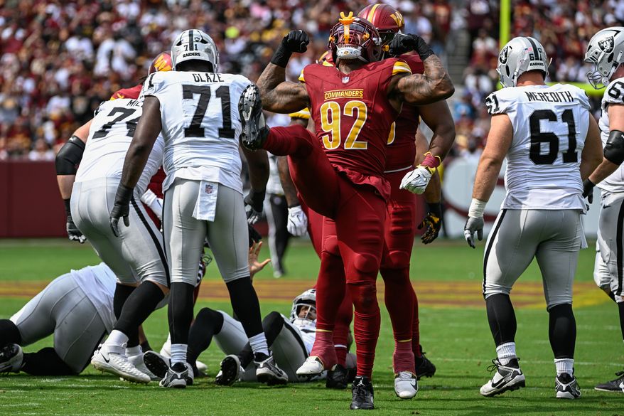 Washington Commanders defensive end Dorance Armstrong (92) celebrates after sacking Las Vegas Raiders quarterback Geno Smith (7) at Northwest Stadium in Landover, Maryland, September 21, 2025. (Photo by Brian Murphy for the Washington Times)