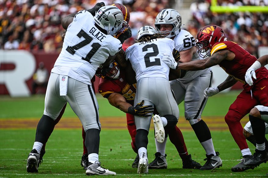 Washington Commanders linebacker Bobby Wagner (54) stuffs Las Vegas Raiders running back Ashton Jeanty (2) at the line of scrimmage during the first half at Northwest Stadium in Landover, Maryland, September 21, 2025. (Photo by Brian Murphy for the Washington Times)