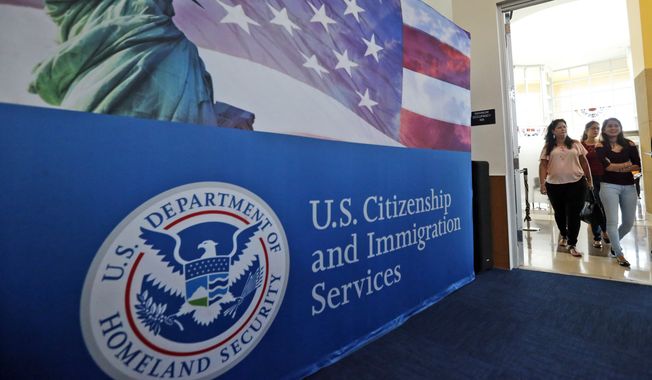 In this Aug. 17, 2018, photo, people arrive before the start of a naturalization ceremony at the U.S. Citizenship and Immigration Services field office in Miami. (AP Photo/Wilfredo Lee) **FILE**