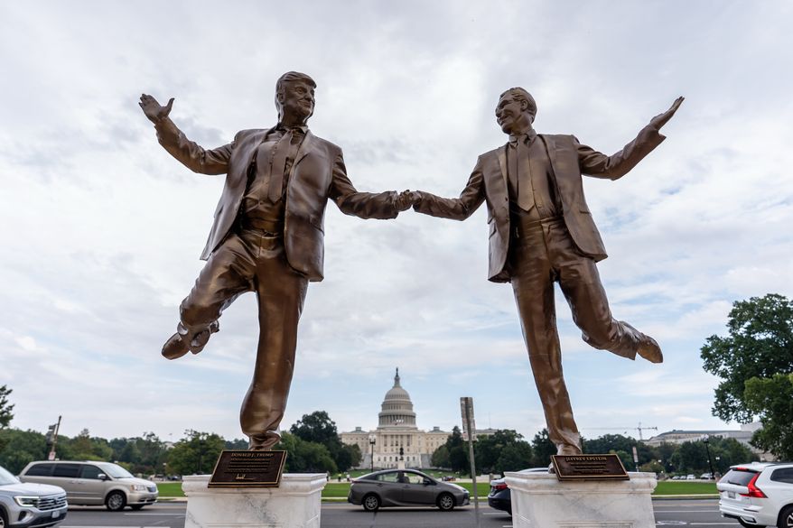 A work of protest art representing President Donald Trump and Jeffrey Epstein is seen on the National Mall near the Capitol, Tuesday, Sept. 23, 2025, in Washington. (AP Photo/Julia Demaree Nikhinson)