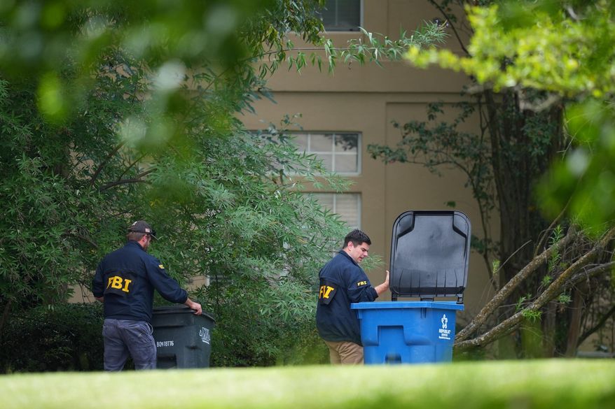 FBI agents look around a home in Fairview, Texas, that public records link to a suspected gunman at a U.S. Immigration and Customs Enforcement office in Dallas, on Wednesday, Sept. 24, 2025. (AP Photo/Julio Cortez)