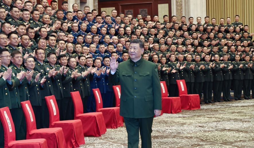 In this photo released by Xinhua News Agency, Chinese President Xi Jinping, also general secretary of the Communist Party of China Central Committee and chairman of the Central Military Commission, meets with representatives of military personnel stationed in Urumqi in northwestern China's Xinjiang Uygur Autonomous Region on Tuesday, Sept. 23, 2025. (Li Gang/Xinhua via AP) ** FILE **