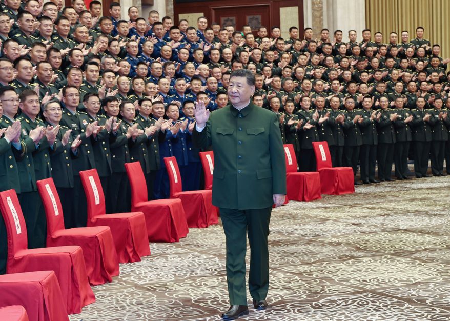 In this photo released by Xinhua News Agency, Chinese President Xi Jinping, also general secretary of the Communist Party of China Central Committee and chairman of the Central Military Commission, meets with representatives of military personnel stationed in Urumqi in northwestern China's Xinjiang Uygur Autonomous Region on Tuesday, Sept. 23, 2025. (Li Gang/Xinhua via AP) ** FILE **