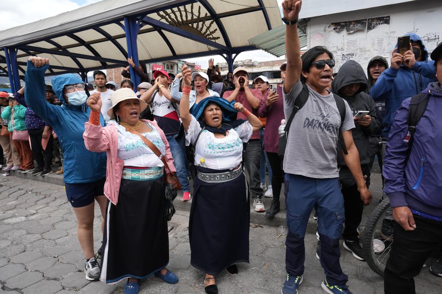 Protesters jeer at Ecuador's President Daniel Noboa as he exits an event in Otavalo, Ecuador, Wednesday, Sept. 24, 2025. (AP Photo/Dolores Ochoa)