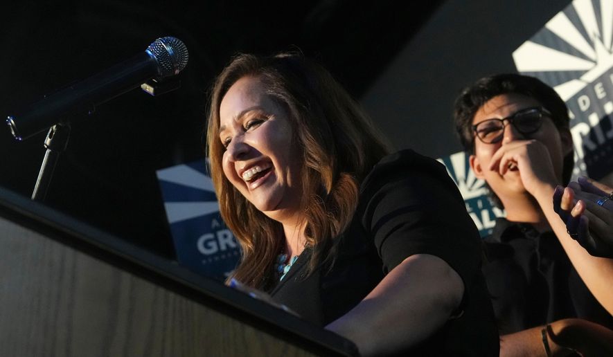 Arizona Democratic candidate Adelita Grijalva, left, smiles as she pauses while speaking to supporters after being declared the winner against Republican Daniel Butierez, to fill the Congressional District 7 seat held by the late U.S. Rep. Raúl Grijalva in a special election Tuesday, Sept. 23, 2025, in Tucson, Ariz. (AP Photo/Ross D. Franklin)