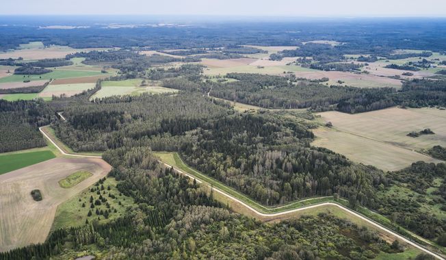 A drone shows an aerial view of the Estonia-Russia border near Vinski, Estonia, Monday, Sept. 15, 2025. (AP Photo/Hendrik Osula)