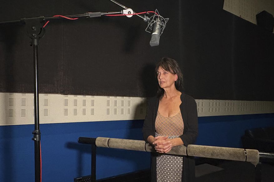 Francoise Cadol poses in a dubbing studio, in Saint Denis, outside Paris, France, Monday, Sept. 15, 2025. (AP Photo/Nicolas Garriga)