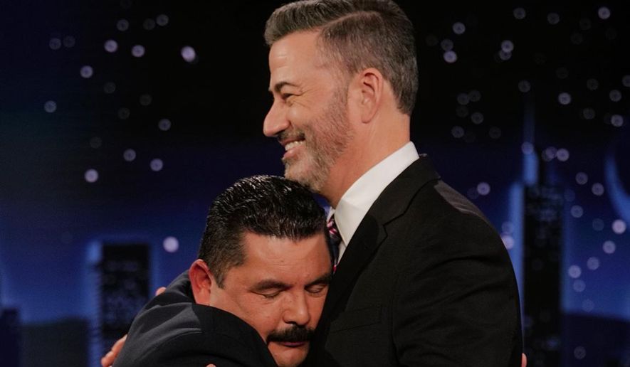 This image released by Disney shows host Jimmy Kimmel being embraced by Guillermo Rodriguez on "Jimmy Kimmel Live!" in Los Angeles on Tuesday, Sept. 23, 2025. (Randy Holmes/Disney via AP)