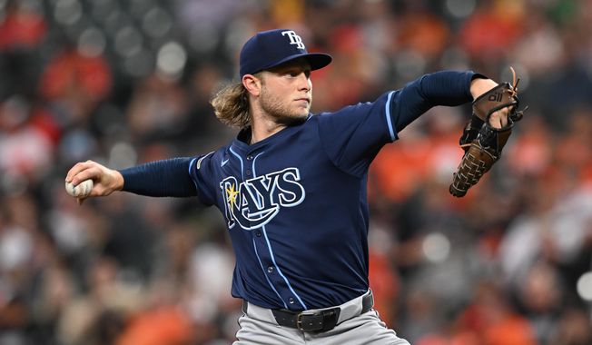Tampa Bay Rays pitcher Shane Baz throws against the Baltimore Orioles in the first inning of a baseball game, Wednesday, Sept. 24, 2025, in Baltimore. (AP Photo/Gail Burton)