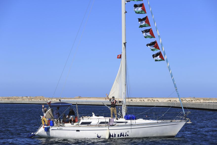 A boat that is part of the Global Sumud Flotilla departs to Gaza to deliver aid amidst Israel's blockade on the Palestinian territory, in the Tunisian port of Bizerte, Saturday, Sept. 13, 2025. (AP Photo/Anis Mili)
