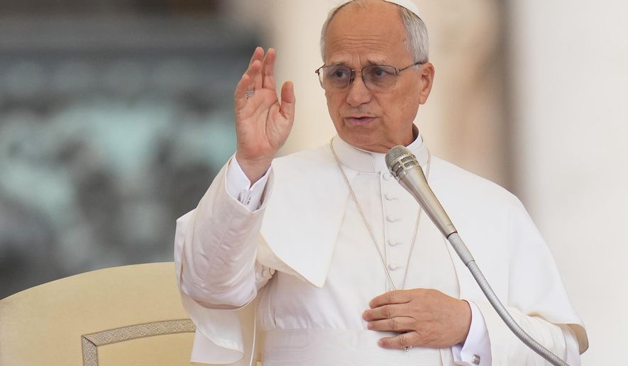 Pope Leo XIV delivers a blessing during the weekly general audience in St. Peter's Square, at the Vatican, Wednesday, Sept. 24, 2025. (AP Photo/Alessandra Tarantino, File)