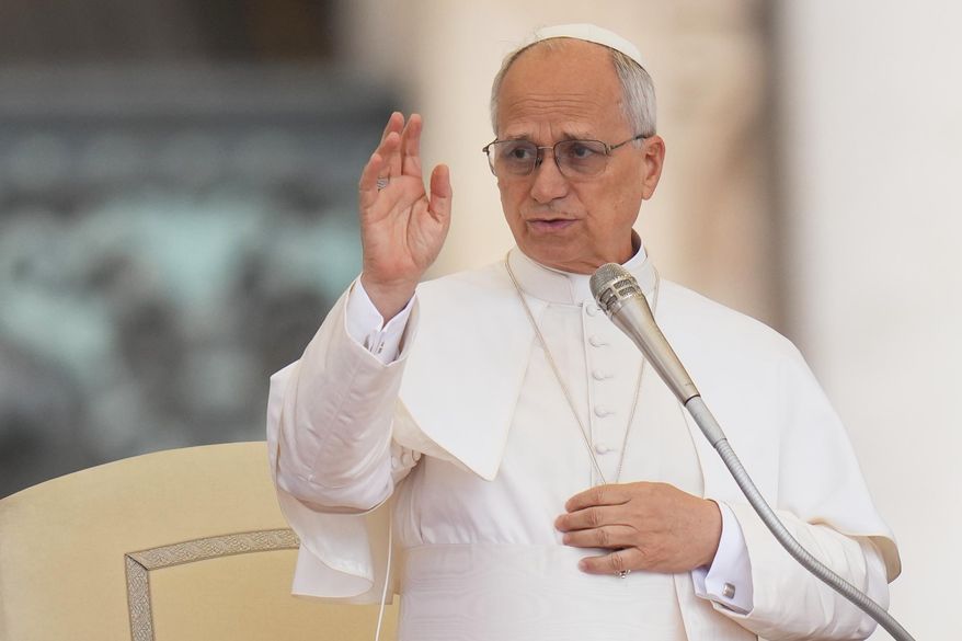 Pope Leo XIV delivers a blessing during the weekly general audience in St. Peter's Square, at the Vatican, Wednesday, Sept. 24, 2025. (AP Photo/Alessandra Tarantino, File)