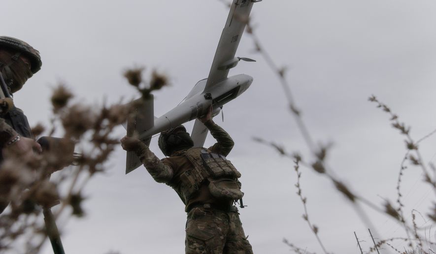 Ukrainian soldiers prepare to launch an Avenger UAV drone in Ukraine's Kharkiv region, Wednesday, Sept. 24, 2025. ( AP Photo/Yevhen Titov) ** FILE **