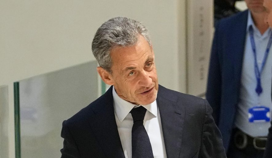 Former French President Nicolas Sarkozy arrives at the courthouse, in Paris, France, Thursday, Sept. 25, 2025. (AP Photo/Christophe Ena)