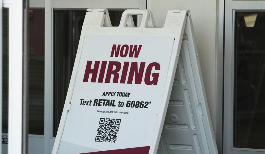 "Now Hiring" sign is displayed at a retail store in Schaumburg, Ill., Thursday, Sept. 18, 2025. (AP Photo/Nam Y. Huh) ** FILE **