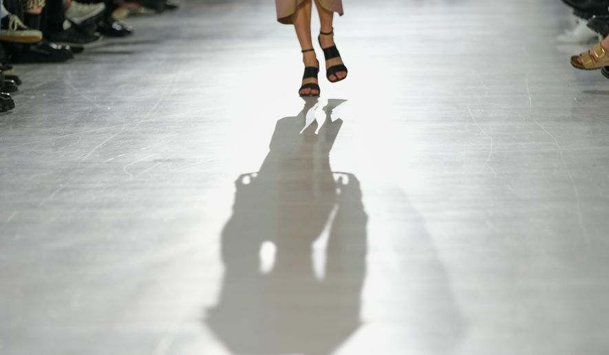 A model wears a creation part of the Max Mara women's Spring-Summer 2026 collection, presented in Milan, Italy, Thursday, Sept. 25, 2025. (AP Photo/Luca Bruno)