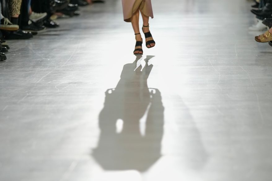 A model wears a creation part of the Max Mara women's Spring-Summer 2026 collection, presented in Milan, Italy, Thursday, Sept. 25, 2025. (AP Photo/Luca Bruno)