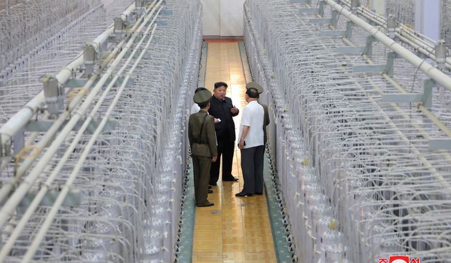 This undated photo provided on Sept. 13, 2024, by the North Korean government shows its leader Kim Jong Un, center, on an inspecting visit at what they say is an institute of nuclear weapons and a facility for nuclear materials at an undisclosed location in North Korea. Independent journalists were not given access to cover the event depicted in this image distributed by the North Korean government. The content of this image is as provided and cannot be independently verified. Korean language watermark on image as provided by source reads: "KCNA" which is the abbreviation for Korean Central News Agency. (Korean Central News Agency/Korea News Service via AP, File)