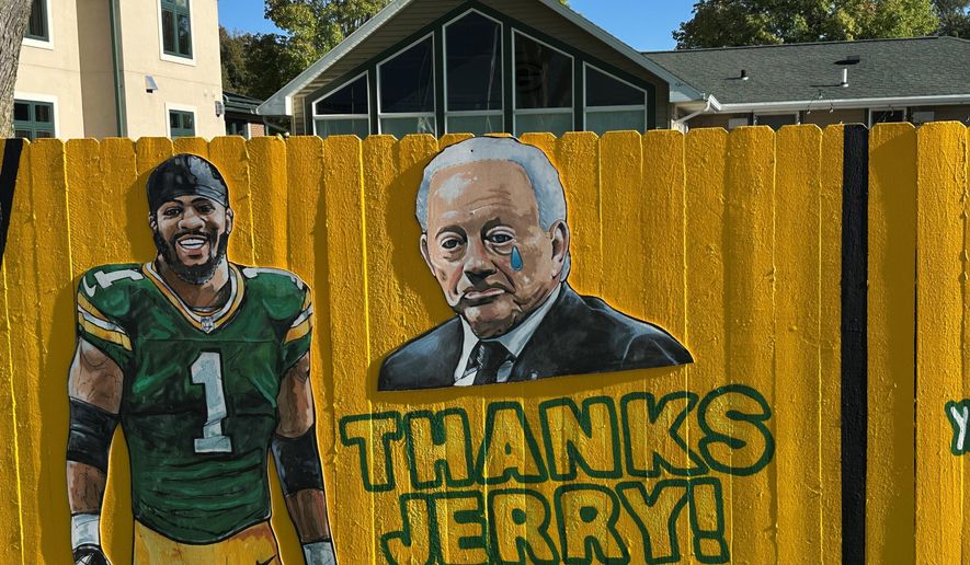 A sign outside a home across the street from Lambeau Field thanks Dallas Cowboy's owner Jerry Jones for trading Micah Parsons to the Green Bay Packers in Green Bay, Wis., on Thursday, Sept. 25, 2025. (AP Photo/Steve Megargee)