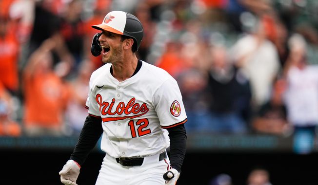 Baltimore Orioles' Dylan Beavers (12) reacts after hitting a walk-off home run in the ninth inning of a baseball game against the Tampa Bay Rays, Thursday, Sept. 25, 2025, in Baltimore. (AP Photo/Stephanie Scarbrough)