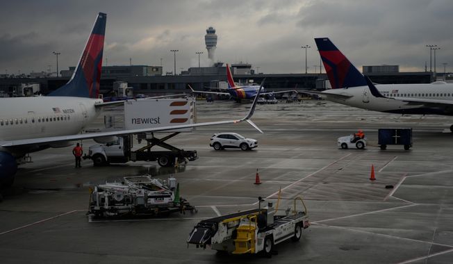 Delta Airlines planes are loaded along the B Concourse at the Hartsfield-Jackson International Airport in Atlanta on Nov. 26, 2024. (AP Photo/Carolyn Kaster) **FILE**