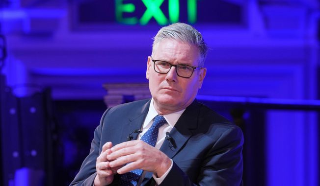 Britain's Prime Minister Keir Starmer listens during a pannel discussion at the Progress Global Action Summit, in London, Friday, Sept. 26, 2025. (AP Photo/Kin Cheung)