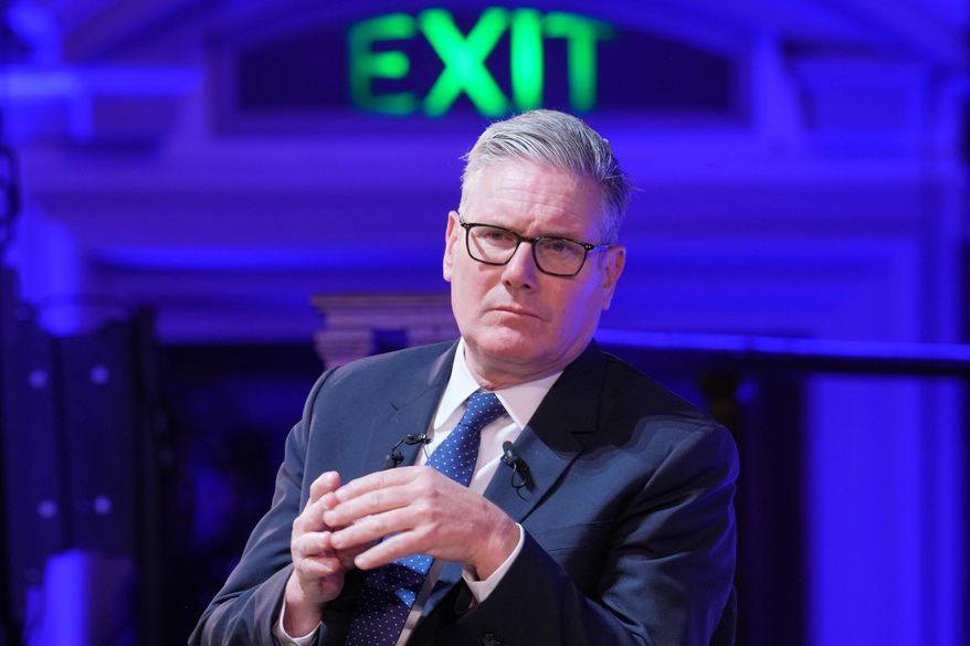 Britain's Prime Minister Keir Starmer listens during a pannel discussion at the Progress Global Action Summit, in London, Friday, Sept. 26, 2025. (AP Photo/Kin Cheung)