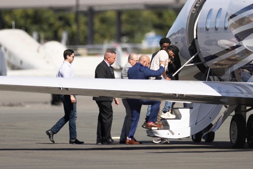 FILE - Harjinder Singh is escorted onto an airplane by Florida Lt. Gov. Jay Collins and law enforcement on Thursday, Aug. 21, 2025, in Stockton, Calif. (AP Photo/Benjamin Fanjoy, file)