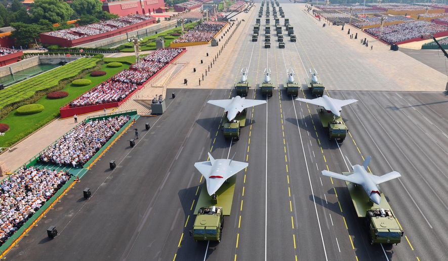 In this photo provided by China's Xinhua News Agency, drones and other armament formations pass during the military parade to commemorate the 80th anniversary of the end of World War II held in front of Tiananmen Gate in Beijing, Wednesday, Sept. 3, 2025. (Liu Xu/Xinhua via AP) **FILE**