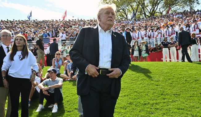 President Donald Trump and his granddaughter Kai Trump, second left, attend the Ryder Cup golf tournament at Bethpage Black Golf Course in Farmingdale, N.Y., Friday, Sept. 26, 2025. (Mandel Ngan/Pool Photo via AP)