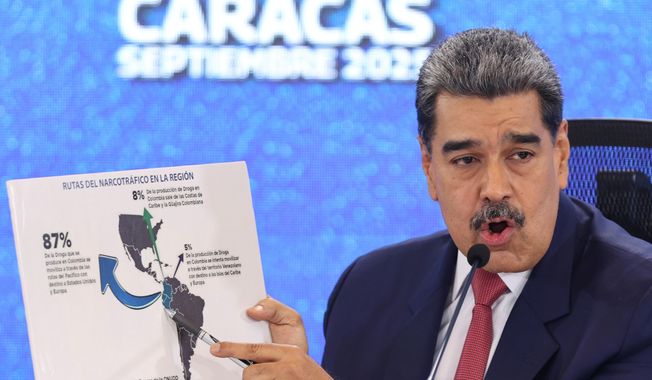 Venezuelan President Nicolas Maduro points at a map of the Americas during a news conference in Caracas, Venezuela, Sept 15, 2025. (AP Photo/Jesus Vargas) ** FILE **