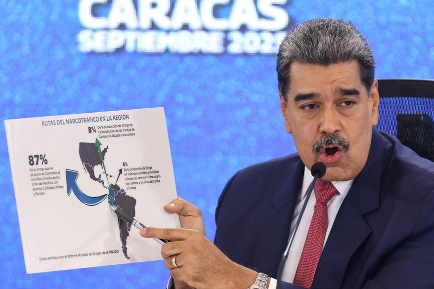 Venezuelan President Nicolas Maduro points at a map of the Americas during a news conference in Caracas, Venezuela, Sept 15, 2025. (AP Photo/Jesus Vargas) ** FILE **