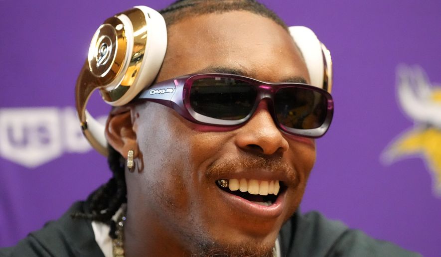 Minnesota Vikings wide receiver Justin Jefferson (18) speaks during a press conference ahead of their match against Pittsburgh Steelers in Dublin, Friday, Sept. 26, 2025.(AP Photo/Frank Augstein)