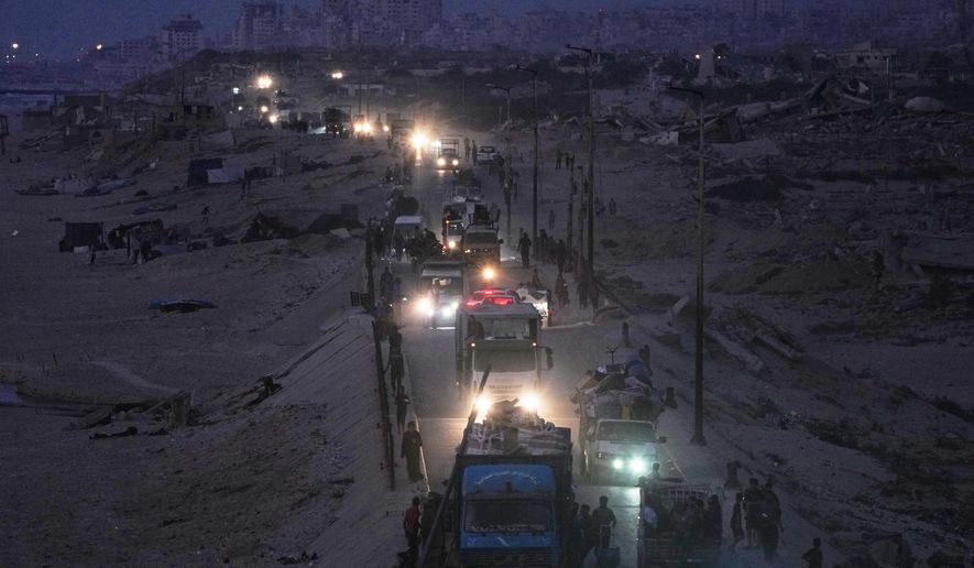 Displaced Palestinians flee northern Gaza, by vehicle and on foot, carrying their belongings along the coastal road near Wadi Gaza, Friday, Sept. 26, 2025. (AP Photo/Abdel Kareem Hana)