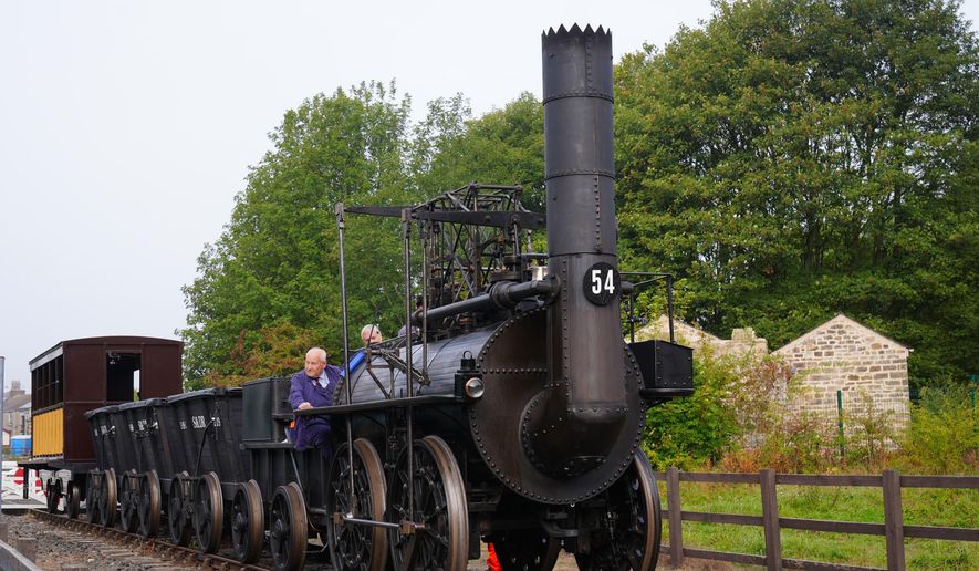 Train driver Chris Cubit on board the Locomotion No 1 replica at the Locomotion Museum in Shildon, County Durham, Friday, Sept. 26, 2025, on its first official journey in 200 years from the Locomotion Museum in Shildon to Darlington, as part of celebrations marking the 200th anniversary of British passenger rail services. (Owen Humphreys/PA via AP)