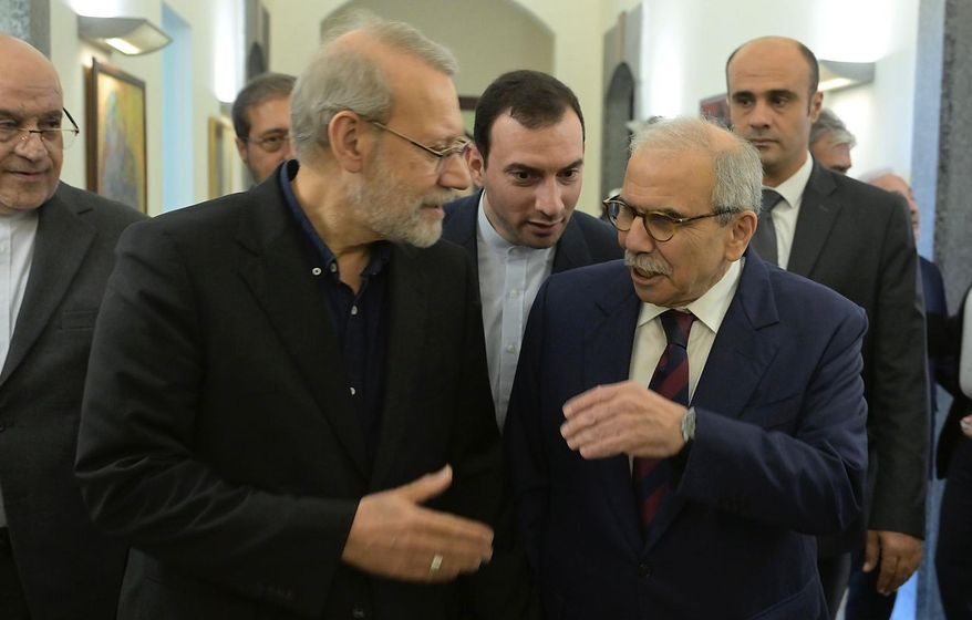 In this photo released by the Lebanese Government Press Office, Lebanese Prime Minister Nawaf Salam, right, speaks with Iranian Secretary of Supreme National Security Council Ali Larijani, at the government palace in Beirut, Lebanon, Saturday, Sept. 27, 205. (Lebanese Government Press Office via AP)